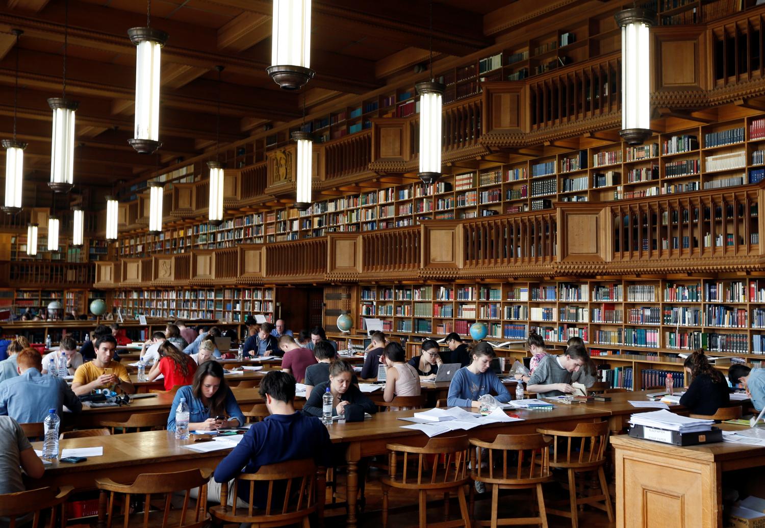 Students sit in the library of the university KU Leuven in Leuven