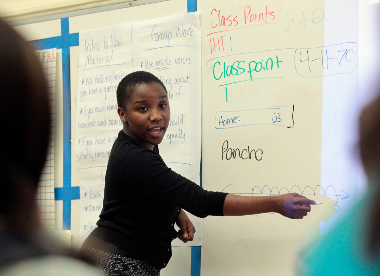 Trainee math teacher Shaw from Teach for America program teaches class at George Washington Carver Middle School in Los Angeles