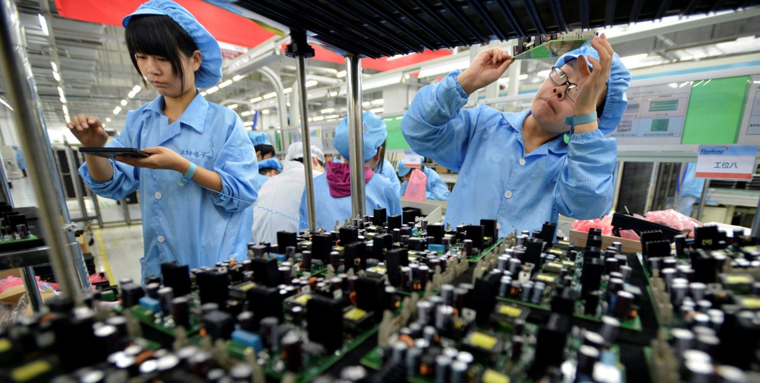 Employees work at a production line of electronic panels at a factory of FiberHome Technologies Group, in Wuhan, Hubei province, China, July 27, 2015. REUTERS/China Daily/File Photo CHINA OUT. NO COMMERCIAL OR EDITORIAL SALES IN CHINA GLOBAL BUSINESS WEEK AHEAD PACKAGE Ð SEARCH ÒBUSINESS WEEK AHEAD JUNE 13Ó FOR ALL IMAGES
