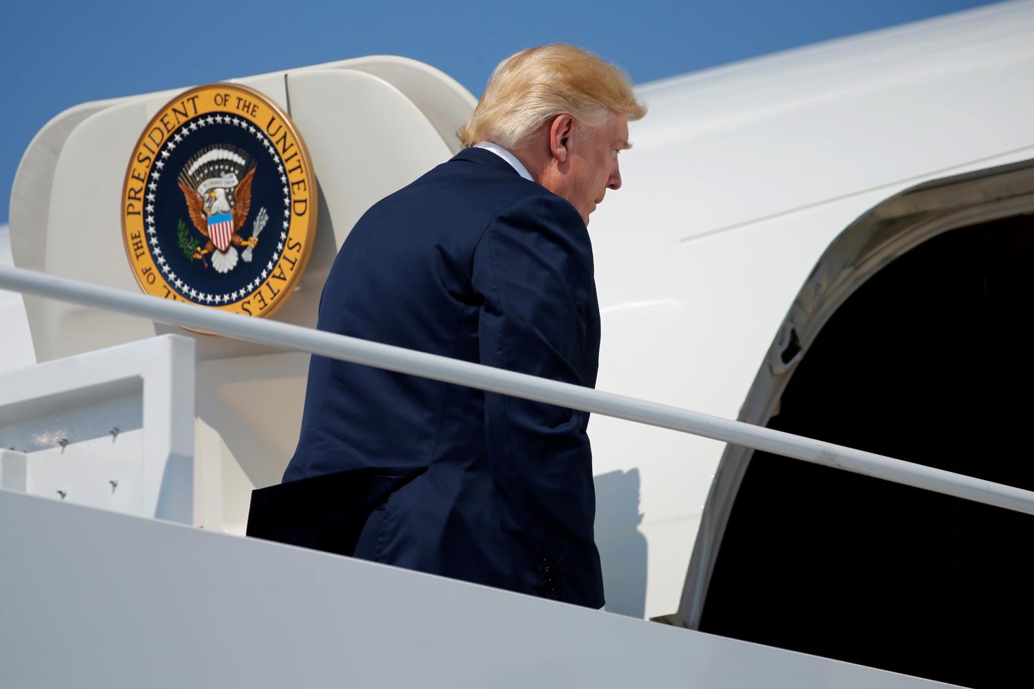 U.S. President Donald Trump boards Air Force One for travel to New Jersey from Joint Base Andrews, Maryland, U.S. August 4, 2017. REUTERS/Jonathan Ernst - RTS1AGGU