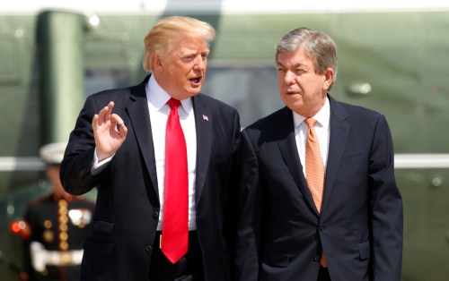 U.S. President Donald Trump and Senator Roy Blunt (R-MO) walk from Marine One to board Air Force One as they depart Joint Base Andrews in Maryland, U.S., August 30, 2017. REUTERS/Kevin Lamarque - RTX3E0T0