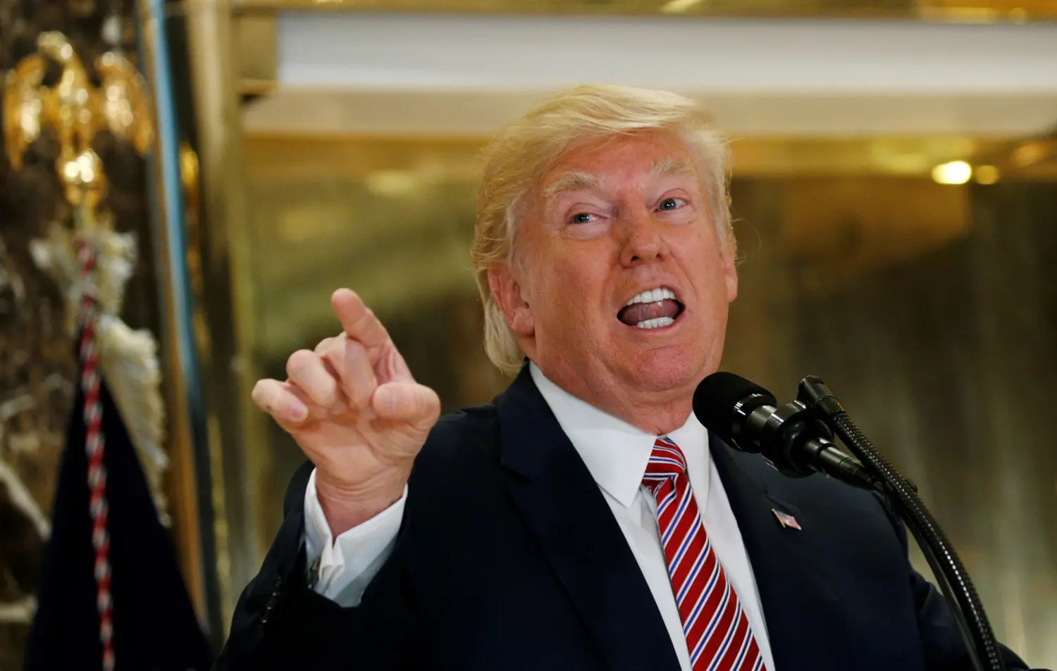 U.S. President Donald Trump answers questions about his responses to the violence, injuries and deaths at the "Unite the Right" rally in Charlottesville as he talks to the media in the lobby of Trump Tower in Manhattan, New York, U.S., August 15, 2017. REUTERS/Kevin Lamarque - RTS1BXI0