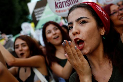 Women rights activists shout slogans during a protest against what they say are violence and animosity they face from men demanding they dress more conservatively, in Istanbul, Turkey, July 29, 2017. REUTERS/Murad Sezer - RC1486CA2300
