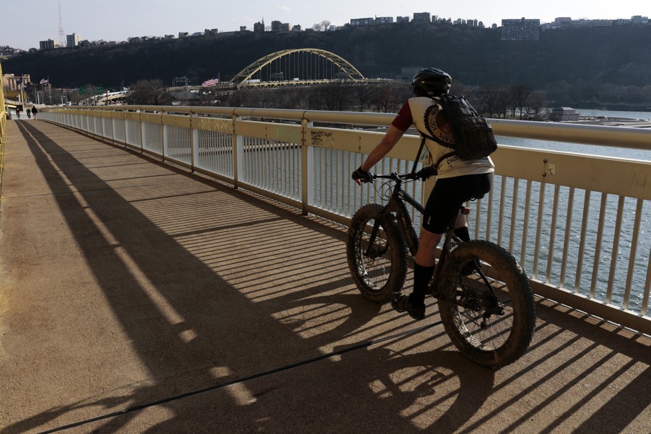 A cyclist on the Fort Duquense Bridge in downtown Pittsburgh. Gene J. Puskar/AP