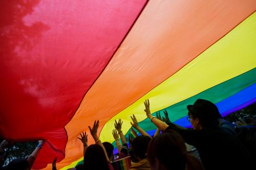 Participants hold a giant rainbow flag during a lesbian, gay, bisexual and transgender (LGBT) Pride Parade in Hong Kong November 8, 2014. Participants from the LGBT communities took to the streets on Saturday to demonstrate for their rights.