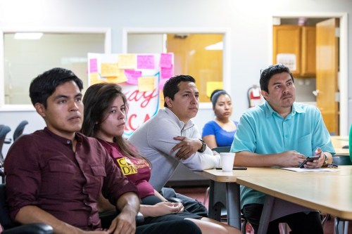 Young DACA recipients, along with Jorge-Mario Cabrera, CHIRLA Communications Director (R), watch U.S. Attorney General Jeff Sessions' announcement on the Deferred Action for Childhood Arrivals (DACA) program, on a projection screen at the Coalition for Humane Immigrant Rights of Los Angeles (CHIRLA) headquarters in Los Angeles, California, U.S., September 5, 2017. REUTERS/Monica Almeida - RC1E6D8D6FF0