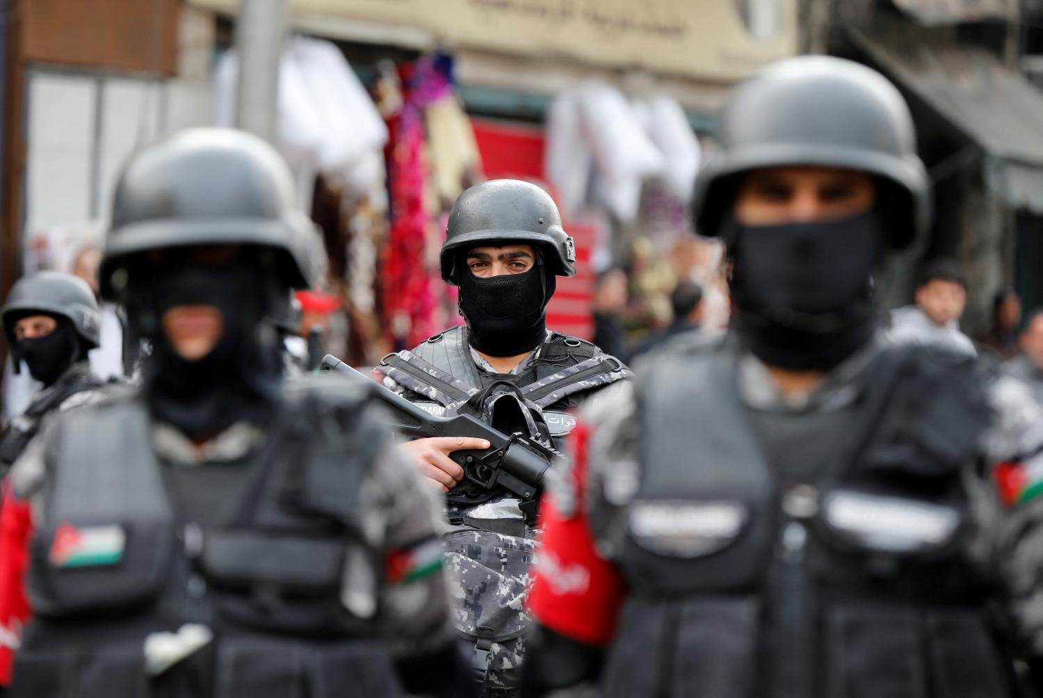 Jordanian policemen stand guard during a rally to support security services after shooting at Karak castle, in Amman, Jordan, December 23, 2016. REUTERS/Muhammad Hamed