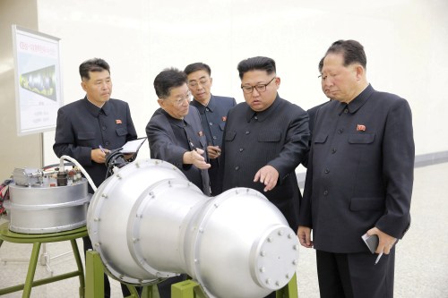 North Korean leader Kim Jong Un provides guidance with Ri Hong Sop (2nd L) and Hong Sung Mu (R) on a nuclear weapons program in this undated photo released by North Korea's Korean Central News Agency (KCNA) in Pyongyang September 3, 2017. KCNA via REUTERS ATTENTION EDITORS - THIS PICTURE WAS PROVIDED BY A THIRD PARTY. REUTERS IS UNABLE TO INDEPENDENTLY VERIFY THE AUTHENTICITY, CONTENT, LOCATION OR DATE OF THIS IMAGE. NOT FOR SALE FOR MARKETING OR ADVERTISING CAMPAIGNS. NO THIRD PARTY SALES. NOT FOR USE BY REUTERS THIRD PARTY DISTRIBUTORS. SOUTH KOREA OUT. NO COMMERCIAL OR EDITORIAL SALES IN SOUTH KOREA. THIS PICTURE IS DISTRIBUTED EXACTLY AS RECEIVED BY REUTERS, AS A SERVICE TO CLIENTS.