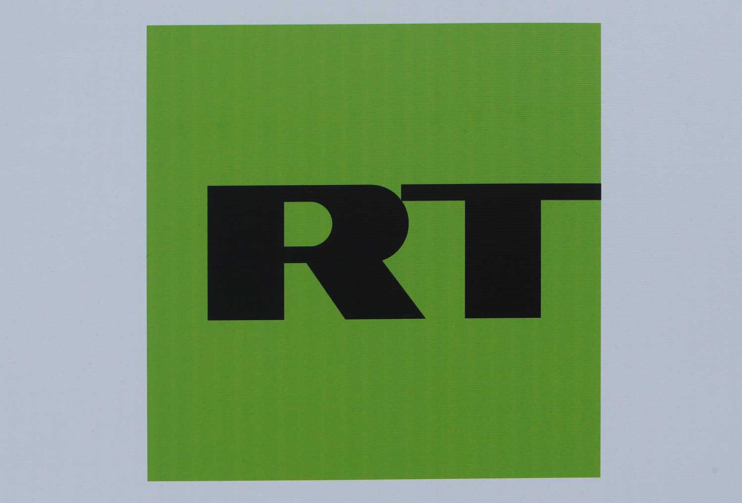 The logo of Russian television network Russia Today (RT) is seen on a board at the St. Petersburg International Economic Forum 2017 (SPIEF 2017) in St. Petersburg, Russia, June 1, 2017. Picture taken June 1, 2017. REUTERS/Sergei Karpukhin - RC14A8979EC0
