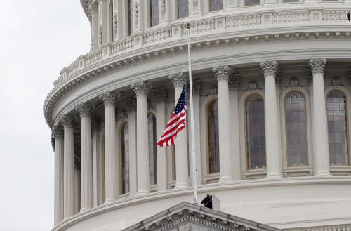 The American flag is changed for a new one on the Capitol building during inauguration ceremonies swearing in Donald Trump as the 45th president of the United States on the West front of the U.S. Capitol in Washington, U.S., January 20, 2017. REUTERS/Mike Segar - HT1ED1K1E2RCE