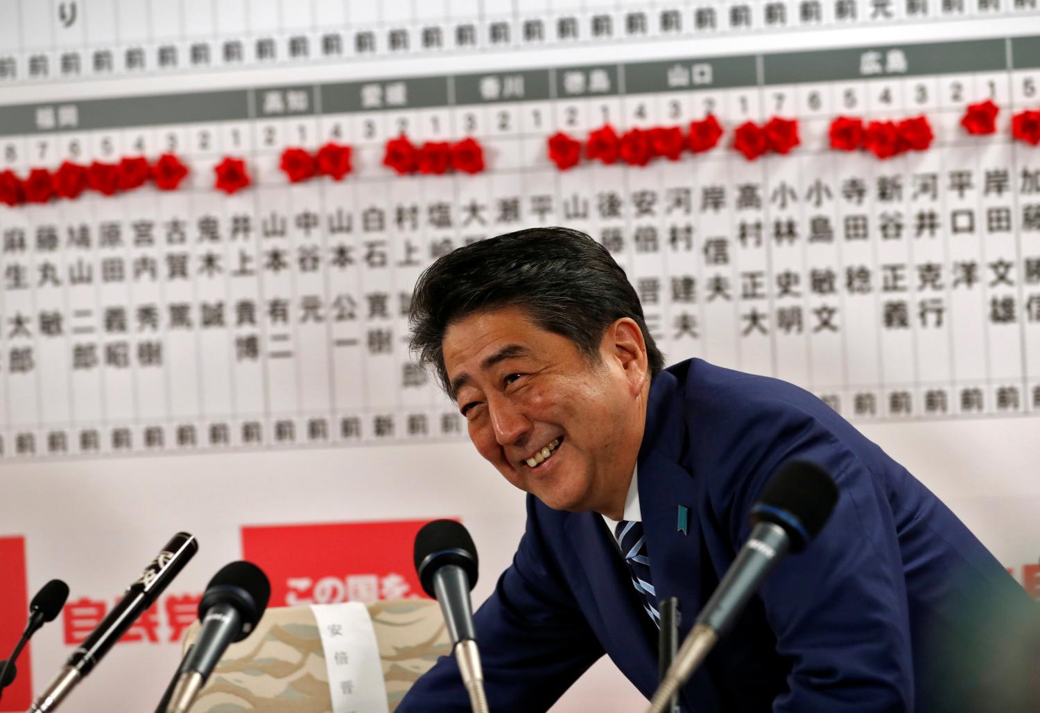 Japan's Prime Minister Shinzo Abe, leader of the Liberal Democratic Party (LDP), smiles during a news conference after Japan's lower house election, at the LDP headquarters in Tokyo, Japan October 22, 2017. REUTERS/Kim Kyung-Hoon - RC16A76A3030
