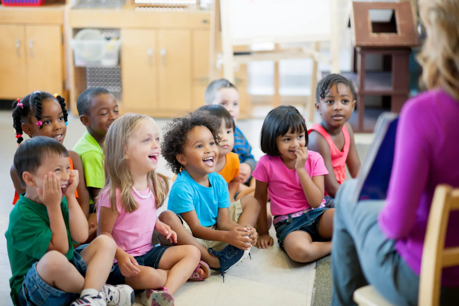 Preschool children in a classroom for story time.