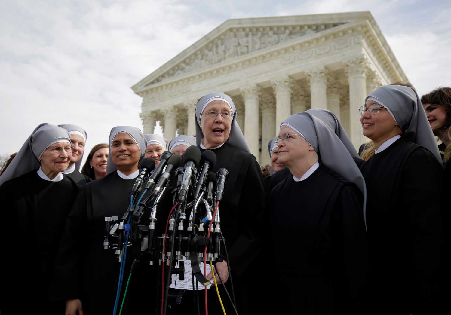 Sister Loraine McGuire with Little Sisters of the Poor speaks to the media after Zubik v. Burwell, an appeal brought by Christian groups demanding full exemption from the requirement to provide insurance covering contraception under the Affordable Care Act, was heard by the U.S. Supreme Court in Washington March 23, 2016. REUTERS/Joshua Roberts TPX IMAGES OF THE DAY - D1AESUEWJUAA