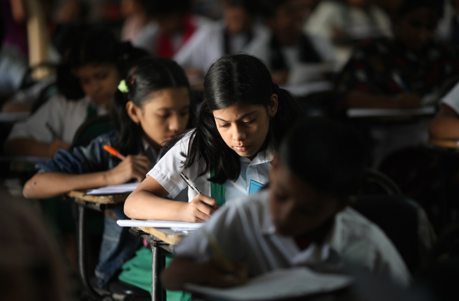 Ten-year-old pupils take part in a public examination at a school in Dhaka