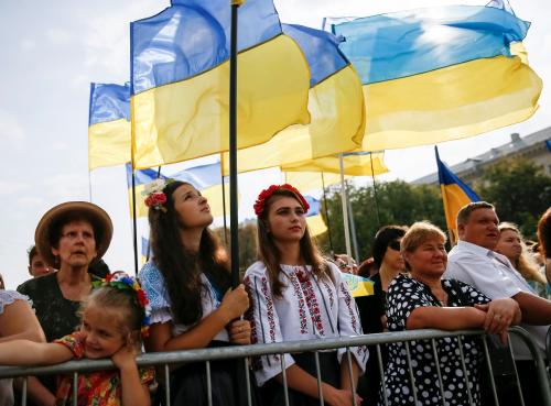 People attend a ceremony marking the Day of the State Flag, on the eve of the Independence Day, in Kiev, Ukraine, August 23, 2016. REUTERS/Gleb Garanich - S1BETXBGVWAB