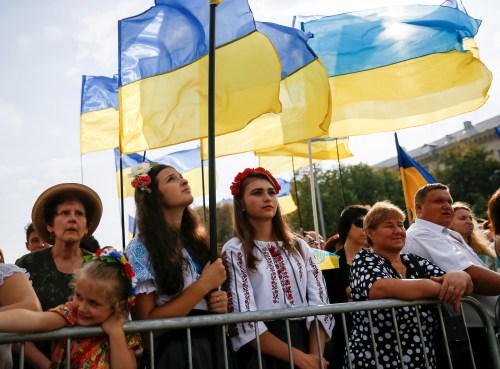 People attend a ceremony marking the Day of the State Flag, on the eve of the Independence Day, in Kiev, Ukraine, August 23, 2016. REUTERS/Gleb Garanich - S1BETXBGVWAB