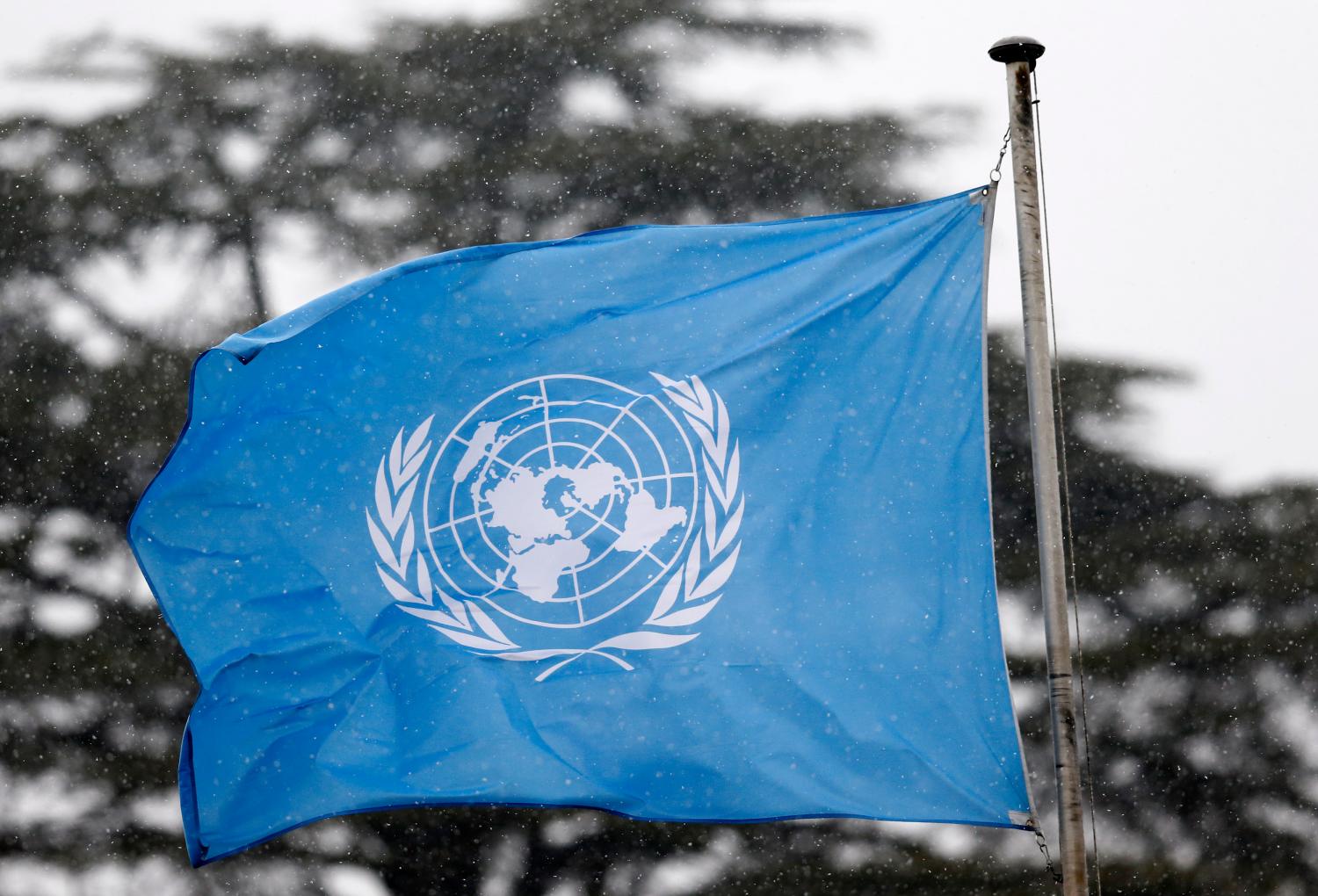 A United Nations flag flies outside the the European headquarters of the United Nations ahead of new round of meetings for the Syria talks in Geneva, Switzerland, March 16, 2016. REUTERS/Denis Balibouse - LR1EC3G0P9FHX