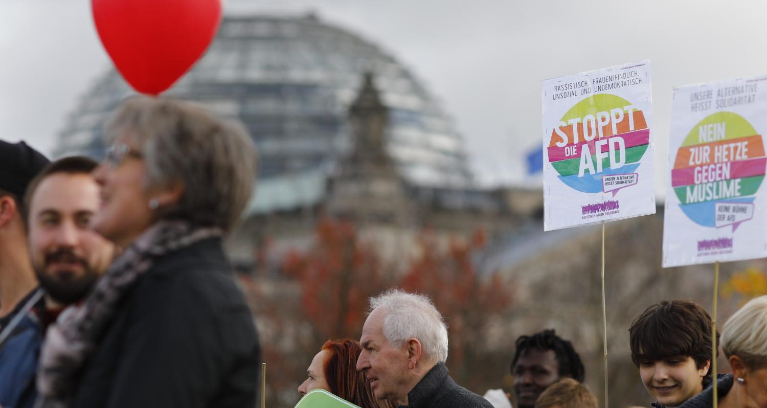 Protesters demonstrate against the anti-immigration party Alternative for Germany (AfD) becoming part of the German lower house of parliament Bundestag for the first time, in Berlin, Germany October 22, 2017. The placard (C) reads, "My voice against hate speaking". REUTERS/Axel Schmidt - UP1EDAM0YOGT5