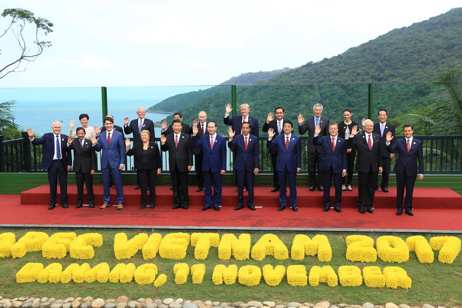 Leaders pose for a group photo at the APEC economic leaders meeting in Danang, Vietnam, November 11, 2017. (L-R): Australian Prime Minister Malcolm Turnbull; Brunei's Sultan Hassanal Bolkiah; Hong Kong Chief Executive Carrie Lam; Canadian Prime Minister Justin Trudeau; Peru's President Pedro Pablo Kuczynski; Chile's President Michelle Bachelet; Philippines President Rodrigo Duterte; China's President Xi Jinping; Russian President Vladimir Putin; Vietnamese President Tran Dai Quang; U.S. President Donald Trump; Indonesian President Joko Widodo; Thailand Prime Minister Prayuth Chan-ocha; Japanese Prime Minister Shinzo Abe; Singapore Prime Minister Lee Hsien Loong; South Korean President Moon Jae-in; New Zealand's Prime Minister Jacinda Ardern; Malaysia's Prime Minister Najib Razak; Taiwan's representative James Soong; Mexican President Enrique Pena Nieto. REUTERS/Hau Dinh/Pool - RC1B9B30FAF0