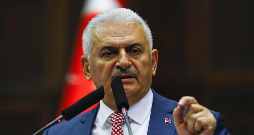 Turkey's new Prime Minister Binali Yildrim addresses members of parliament from his ruling AK Party (AKP) during a meeting at the Turkish parliament in Ankara, Turkey, May 24, 2016. REUTERS/Umit Bektas - LR1EC5O0RQVYJ