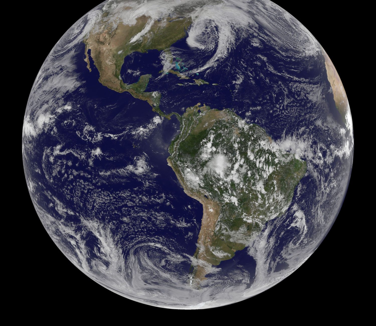 NOAA's GOES-13 and GOES-15 satellite image from March 31, 2014 and released on April 1, 2014 shows the low pressure systems in the eastern Pacific Ocean, over the United States' Heartland, and in the eastern Atlantic Ocean. All three lows have the signature comma shape that make them appear to be curled up dragons.