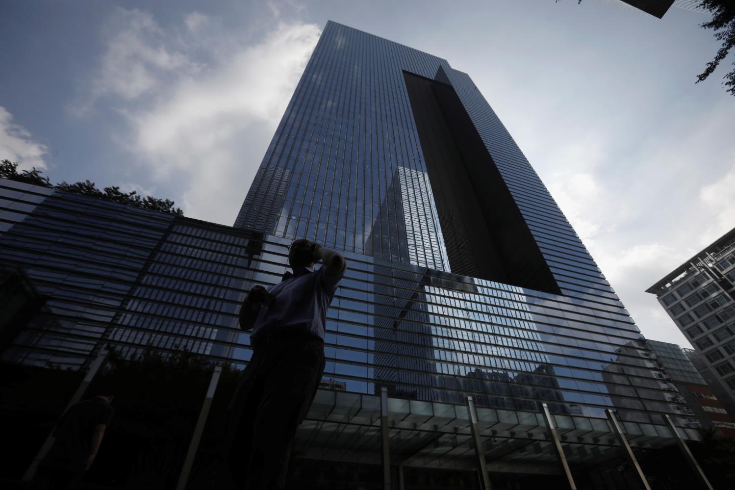 An employee walks past a Samsung Electronics office building.