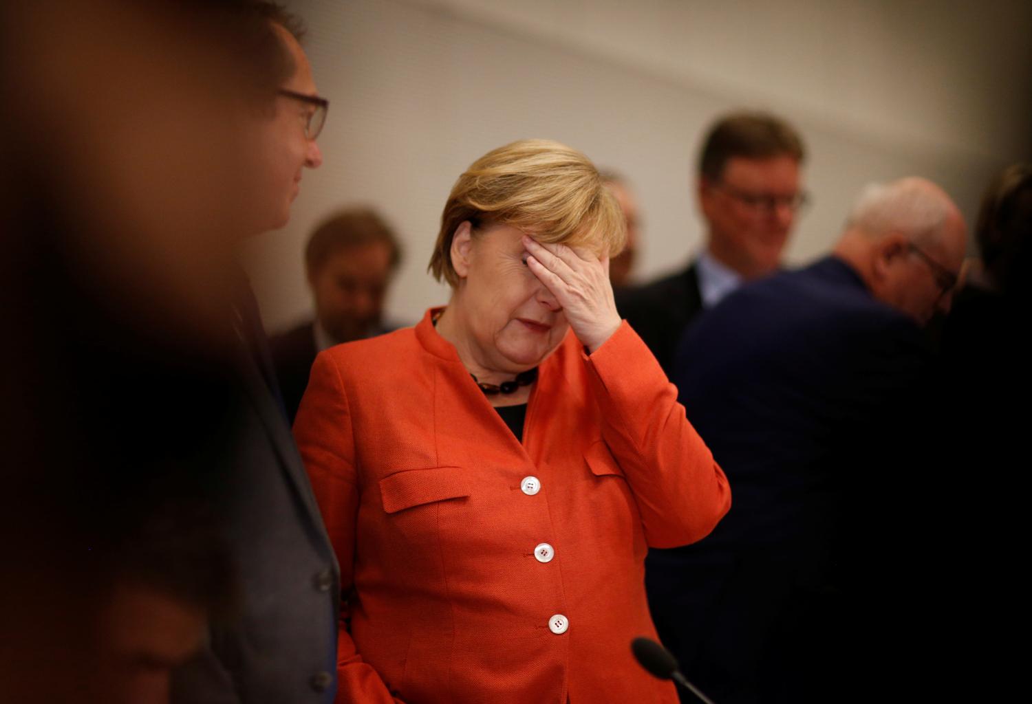 German Chancellor Angela Merkel attends a meeting of the CDU/CSU parliamentary group at the Bundestag in Berlin, Germany, November 20, 2017. REUTERS/Axel Schmidt - RC1A0BBFB2F0