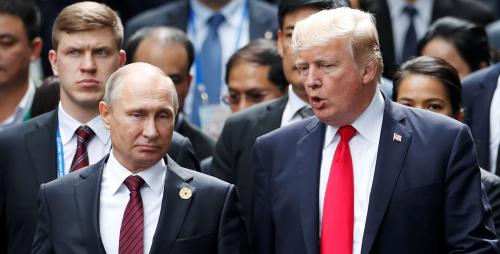 U.S. President Donald Trump and Russia's President Vladimir Putin talk during the family photo session at the APEC Summit in Danang, Vietnam November 11, 2017. REUTERS/Jorge Silva