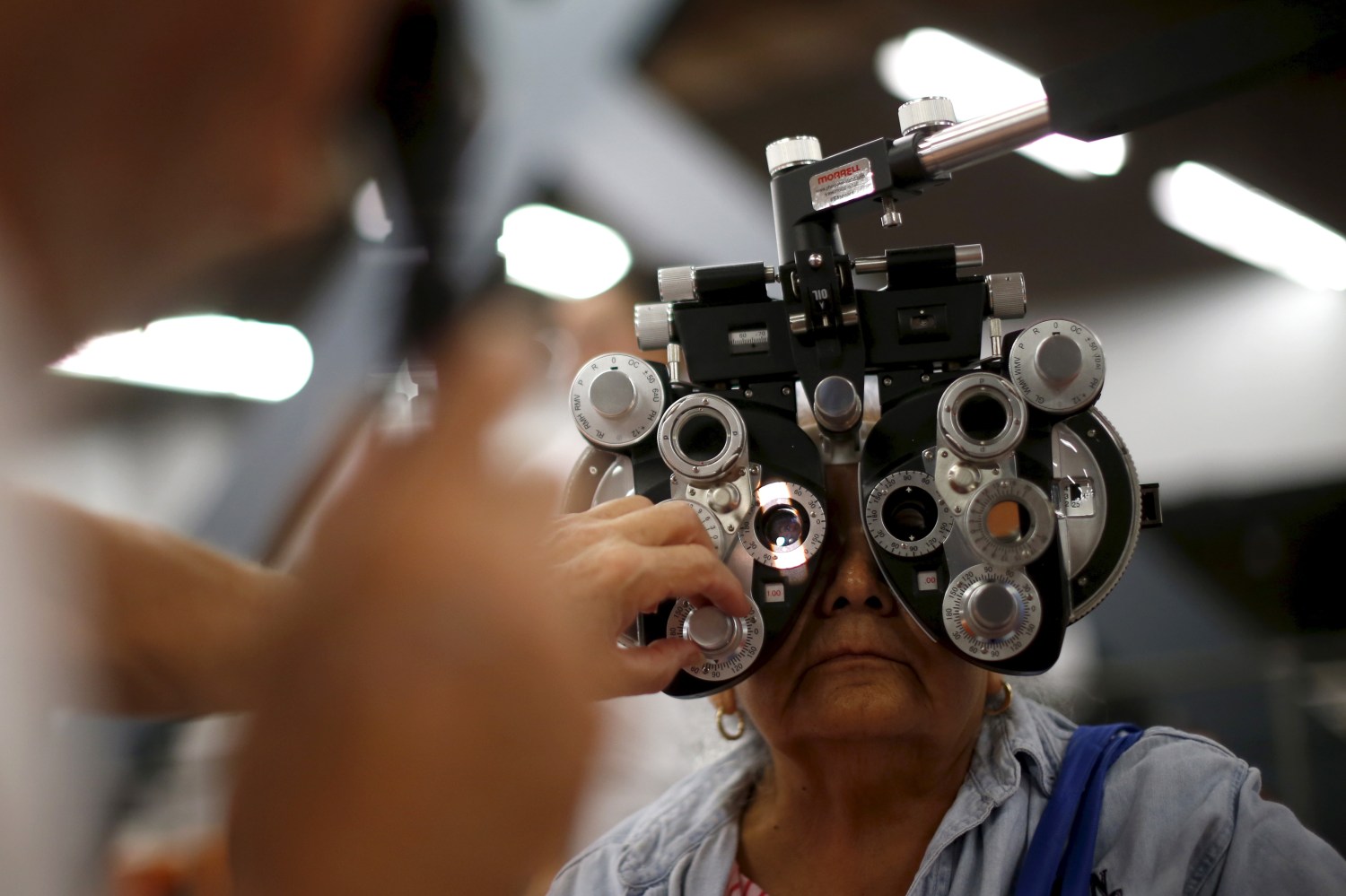 A woman has her eyes examined