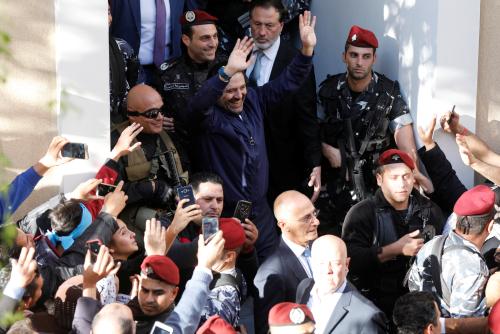 Saad al-Hariri who suspended his decision to resign as prime minister gestures to his supporters at his home in Beirut, Lebanon November 22, 2017. REUTERS/Jamal Saidi