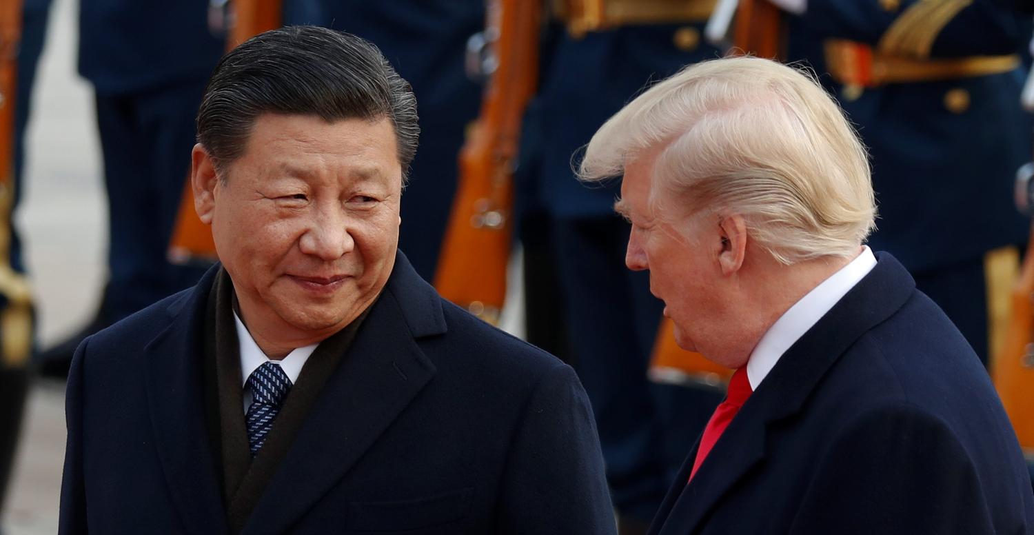 U.S. President Donald Trump takes part in a welcoming ceremony with China's President Xi Jinping at the Great Hall of the People in Beijing, China, November 9, 2017. REUTERS/Damir Sagolj - RC1CB94FD460