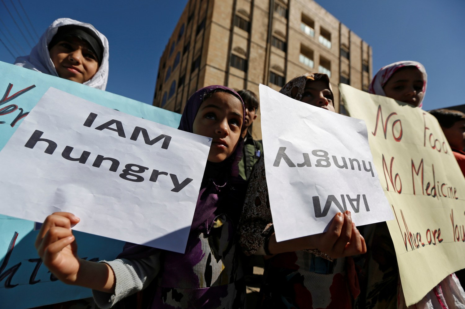 Girls protest against the Saudi-led coalition outside the U.N. offices in Sanaa, Yemen November 20, 2017. REUTERS/Khaled Abdullah