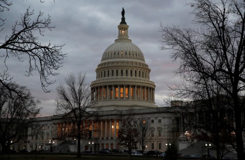 The U.S. Capitol building is lit at dusk ahead of planned votes on tax reform in Washington, U.S., December 18, 2017. REUTERS/Joshua Roberts - RC12EC274A10