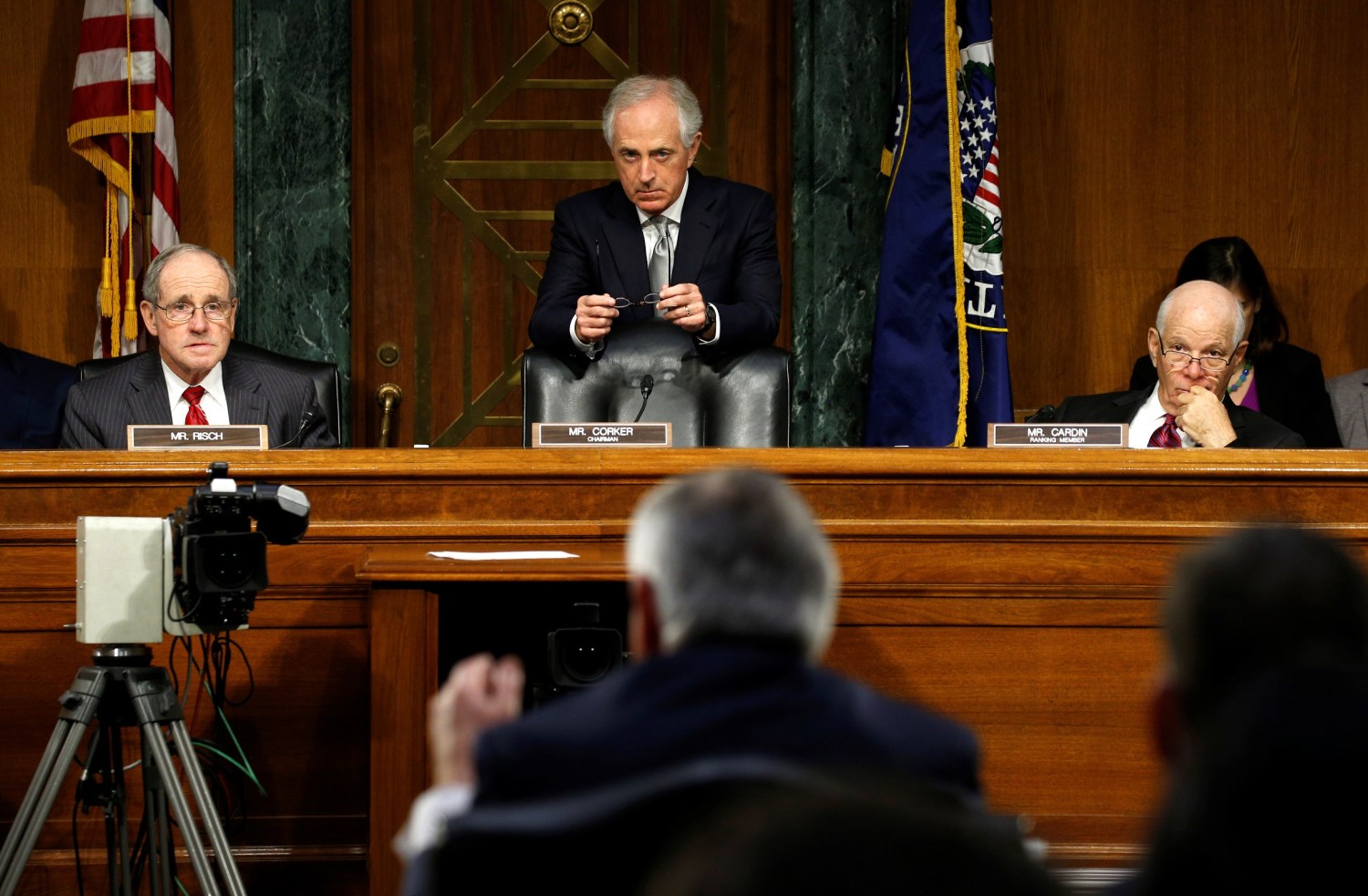 Senate Foreign Relations Committee Chairman Bob Corker (C) listens as Secretary of State nominee Rex Tillerson (foreground) testifies during his confirmation hearing on Capitol Hill in Washington, U.S. January 11, 2017. REUTERS/Kevin Lamarque - RC1CA93CEDC0