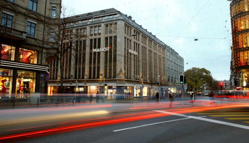 A longtime exposure shows traffic flowing in front of the Manor department store at the Bahnhofstrasse shopping street