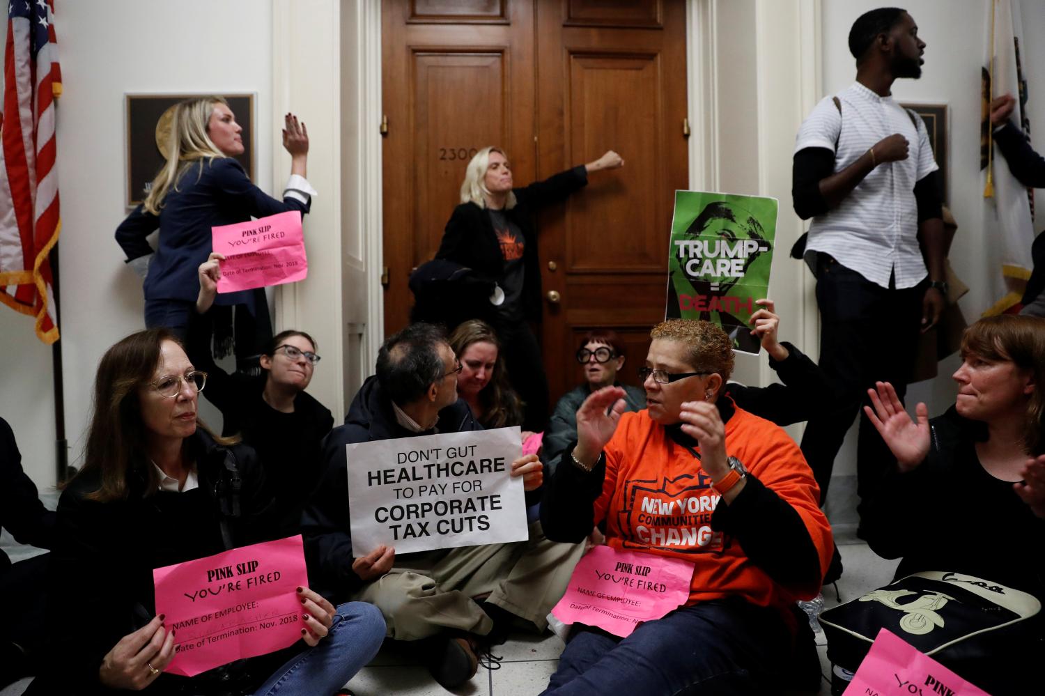 Demonstrators protest against the tax bill.