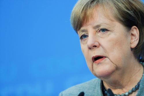 Acting German Chancellor Angela Merkel address a news conference at the Christian Democratic Union (CDU) party headquarters in Berlin, Germany, December 18, 2017. REUTERS/Hannibal Hanschke