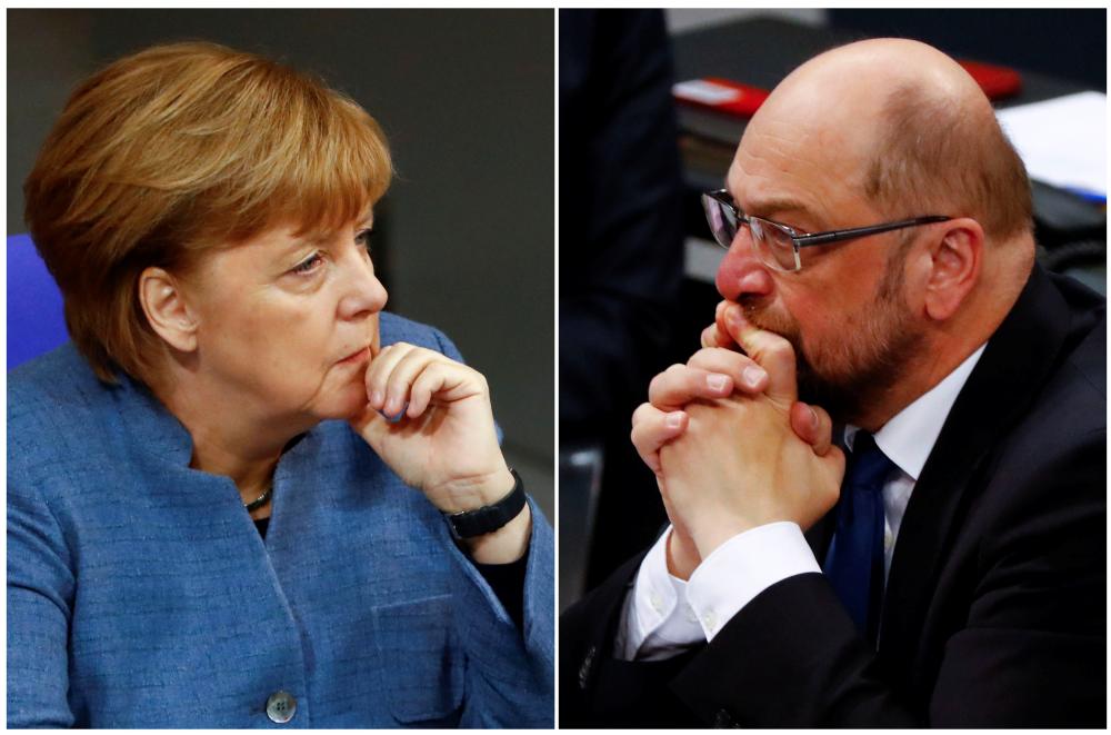 A combination of two photos show German Chancellor Angela Merkel and Social Democratic Party (SPD) leader Martin Schulz as they attend a debate of the lower house of parliament Bundestag in Berlin, Germany, December 12, 2017. REUTERS/Fabrizio Bensch