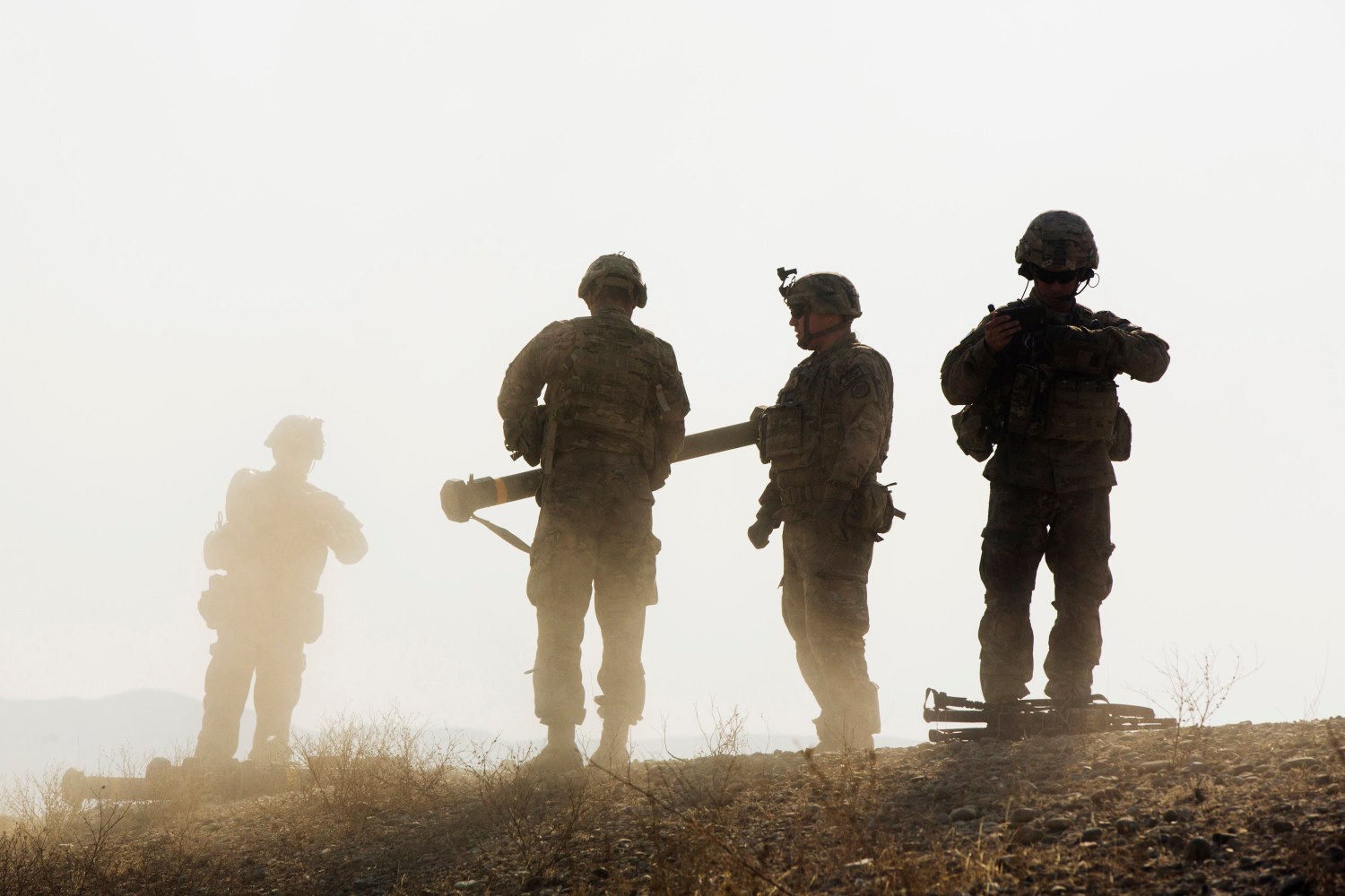 U.S. soldiers from D Troop of the 3rd Cavalry Regiment walk on hill after finishing with a training exercise near forward operating base Gamberi in the Laghman province of Afghanistan