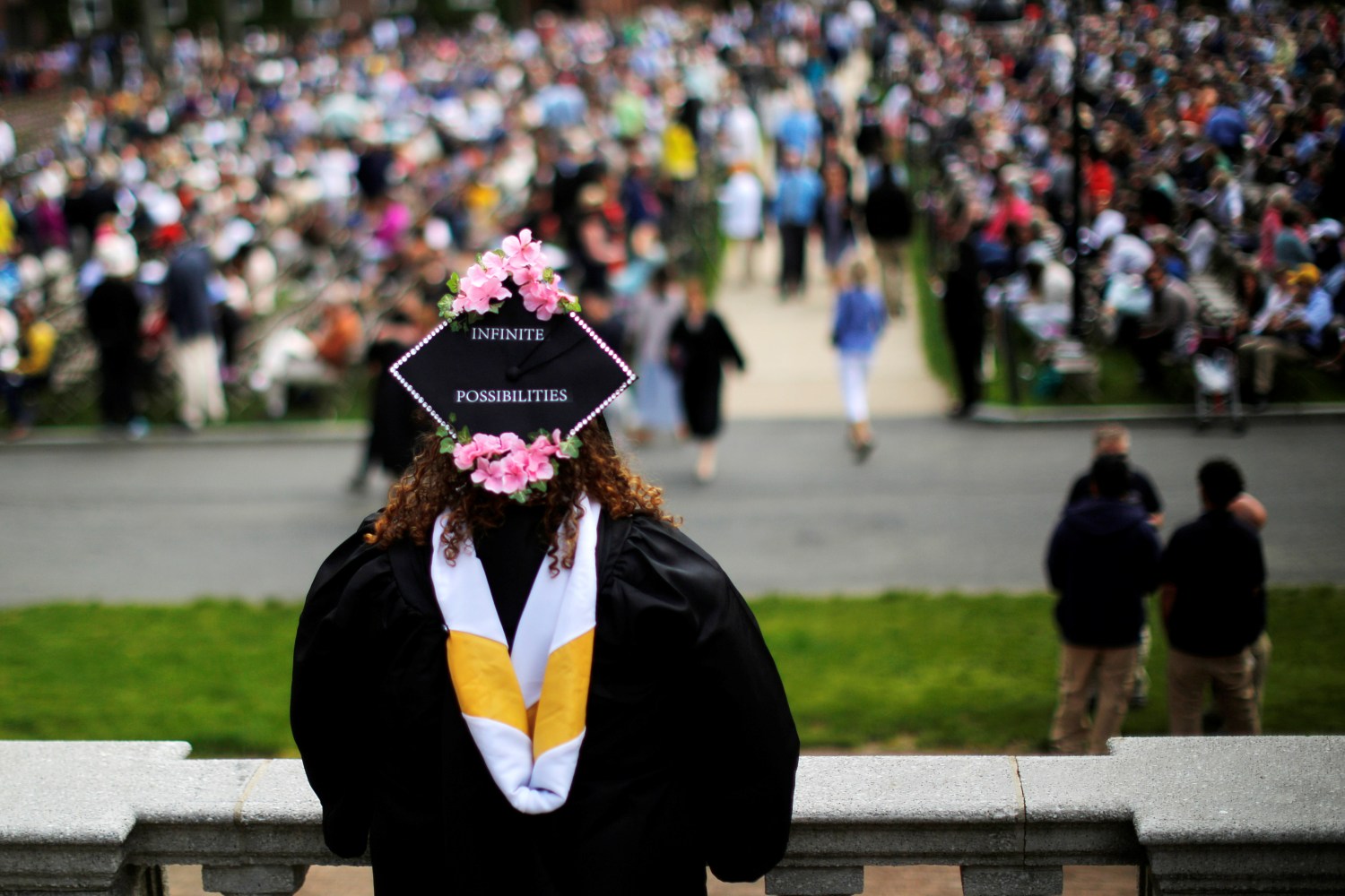 A senior with "Infinite Possibilities" written on her cap waits to graduate during Commencement at Smith College in Northampton, Massachusetts, U.S., May 21, 2017.