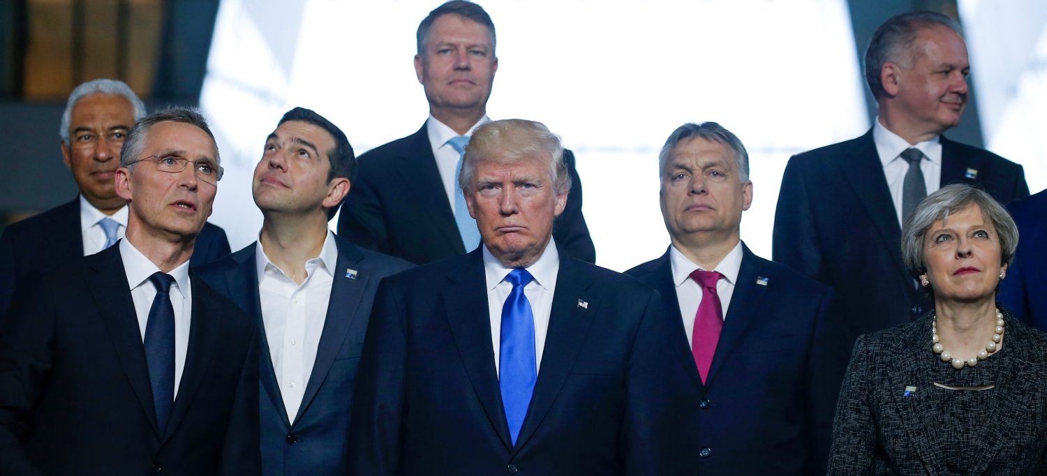 (L-R) Portuguese Prime Minister Antonio Costa, NATO Secretary General Jens Stoltenberg, Greek Prime Minister Alexis Tsipras, U.S. President Donald Trump, Hungarian Prime Minister Voktor Orban and Britain's Prime Minister Theresa May pose for a family photo during a NATO summit at their new headquarters in Brussels, Belgium, May 25, 2017. REUTERS/Jonathan Ernst - RC1A2CA388C0