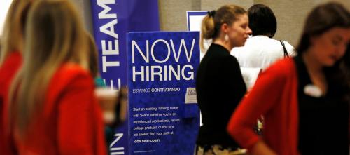 Recruiters and job seekers are seen at a job fair in Golden