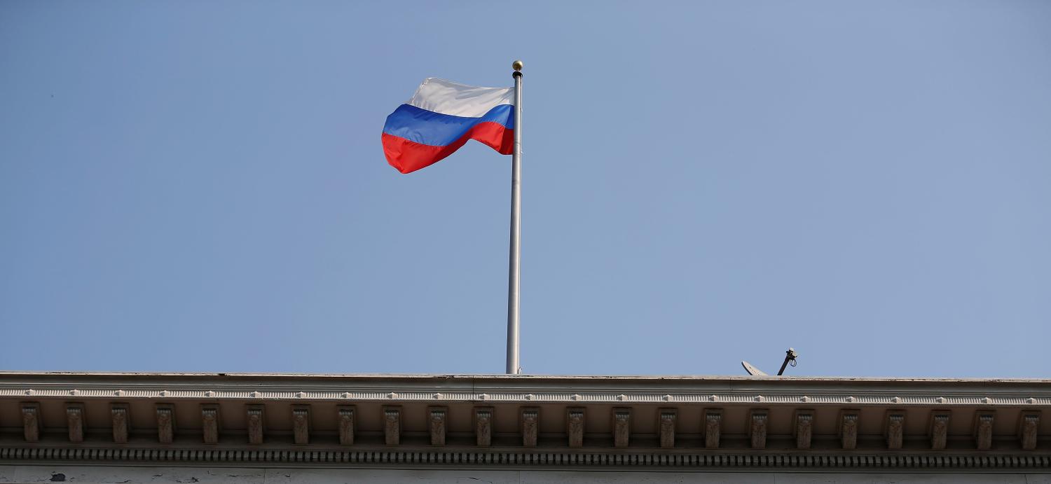The Russian flag waves in the wind on the rooftop of the Consulate General of Russia in San Francisco, California, U.S., September 2, 2017. REUTERS/Stephen Lam - RC1687F46500