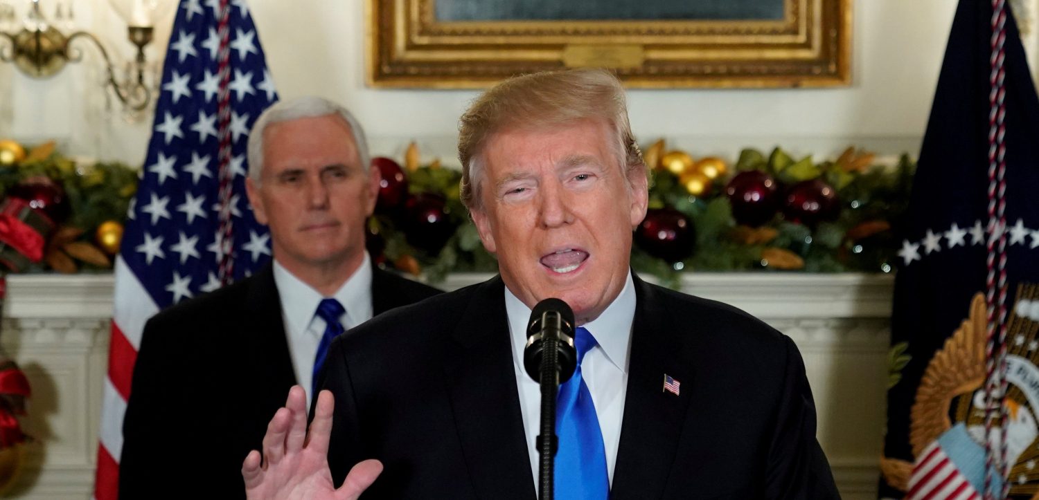 U.S. President Donald Trump, flanked by ?Vice President Mike Pence?, delivers remarks recognizing Jerusalem as the capital of Israel at the White House in Washington, U.S. December 6, 2017. REUTERS/Jonathan Ernst - RC13960599F0