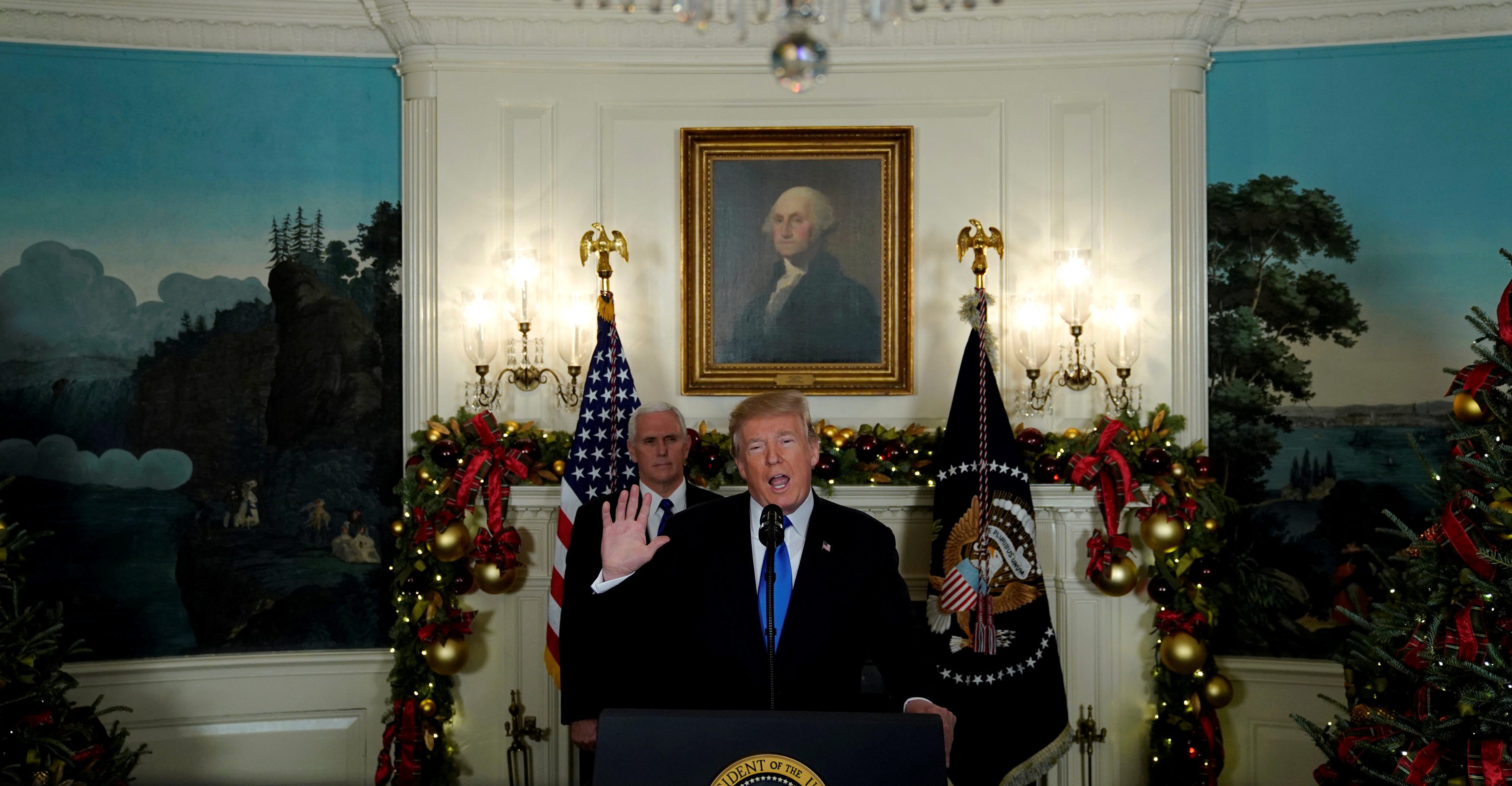 U.S. President Donald Trump, flanked by ?Vice President Mike Pence?, delivers remarks recognizing Jerusalem as the capital of Israel at the White House in Washington, U.S. December 6, 2017. REUTERS/Jonathan Ernst - RC1F9F0D1440