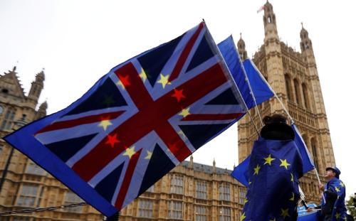 Anti-Brexit protesters wave EU and Union flags outside the Houses of Parliament in London, Britain, November 14, 2017. REUTERS/Peter Nicholls TPX IMAGES OF THE DAY - RC165ADC9380