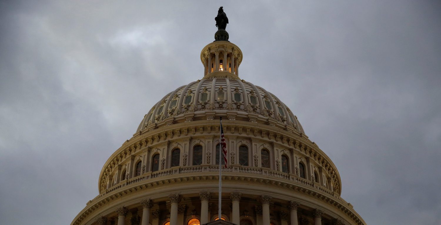 The U.S. Capitol building is lit at dusk ahead of planned votes on tax reform in Washington, U.S., December 18, 2017. REUTERS/Joshua Roberts - RC1E477B1960
