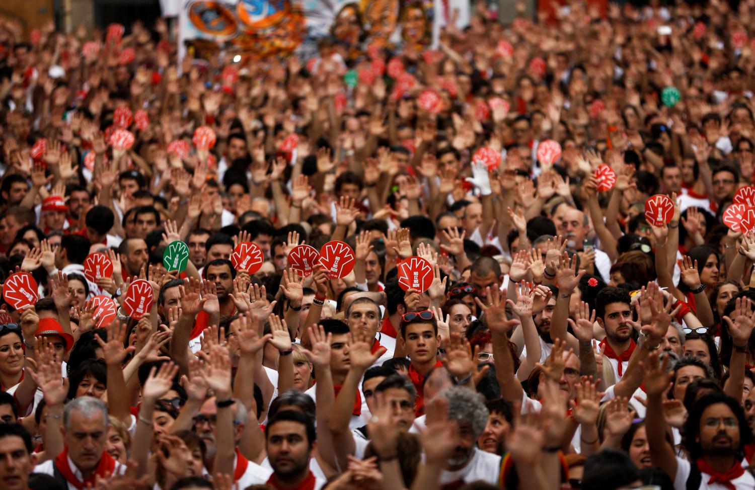 People take part in a protest against sexual violence against women during the San Fermin festival in Pamplona, northern Spain, July 7, 2016. REUTERS/Susana Vera - S1AETOGPURAA