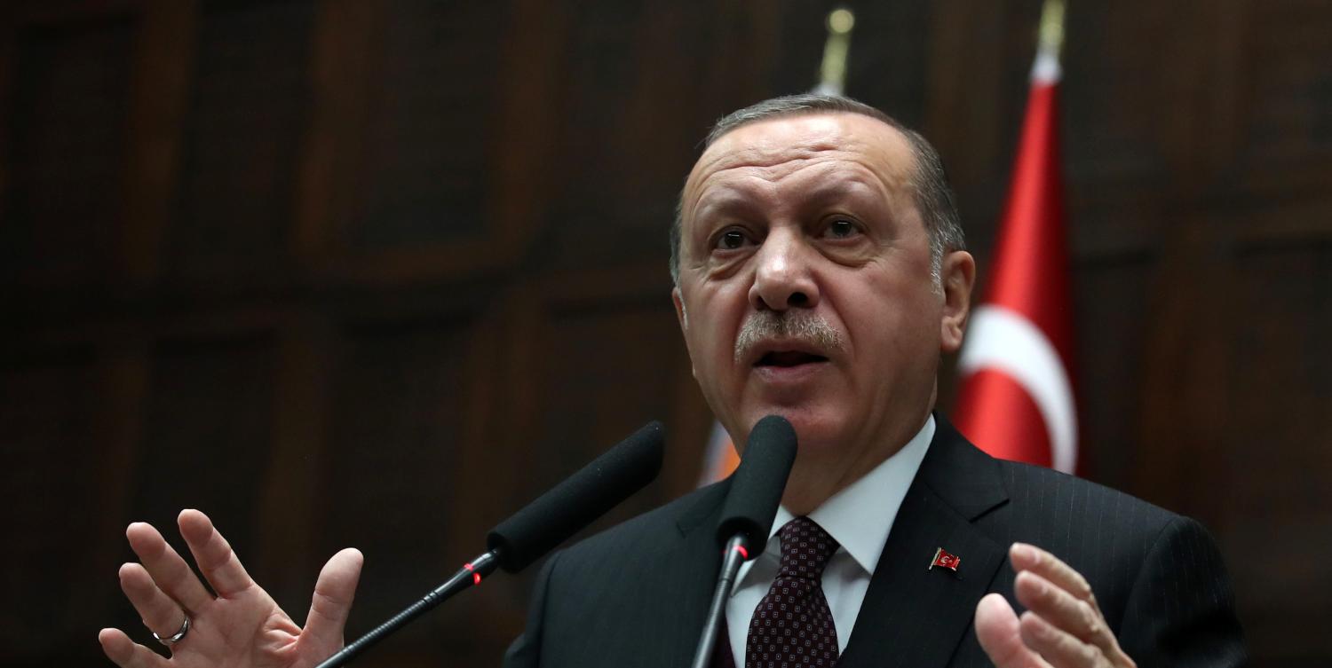 Turkish President Tayyip Erdogan addresses members of parliament from his ruling AK Party (AKP) during a meeting at the Turkish parliament in Ankara, Turkey, January 9, 2018. REUTERS/Umit Bektas - RC16EF25B160