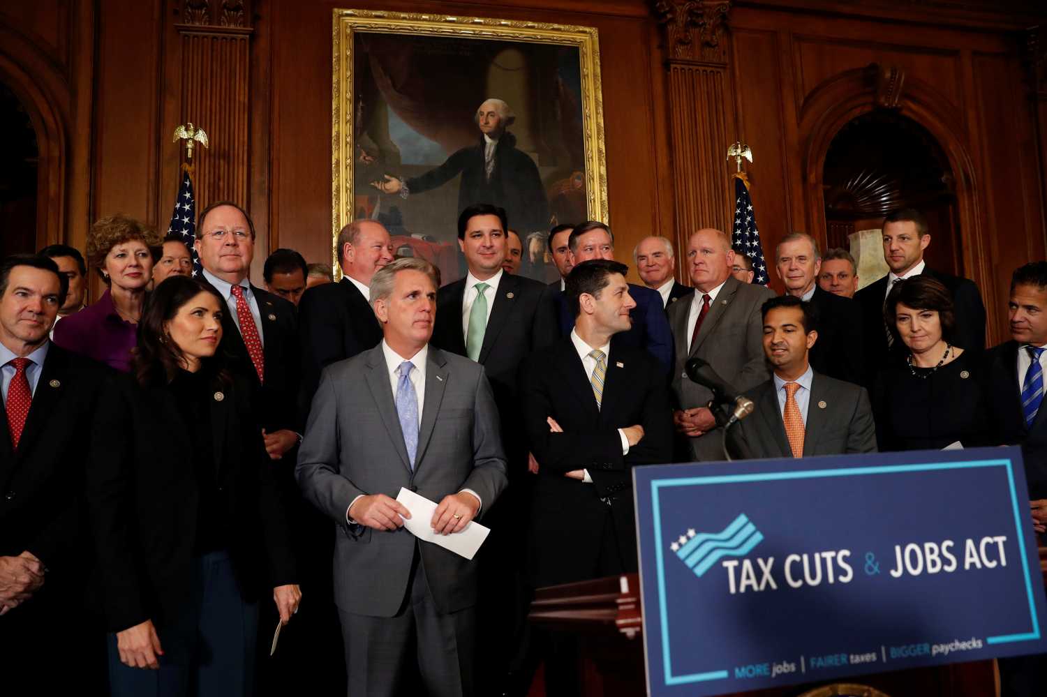House Republicans including Speaker of the House Paul Ryan await the start of a news conference announcing the passage of the "Tax Cuts and Jobs Act" at the U.S. Capitol in Washington